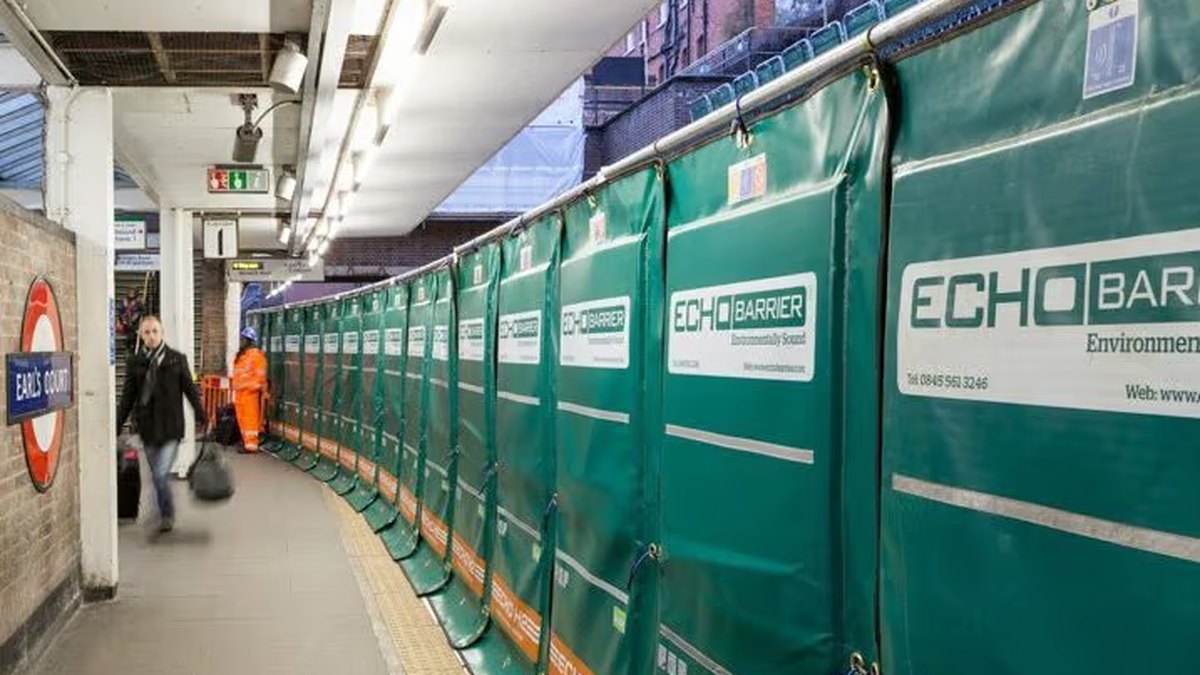 Echo Barrier temporary acoustic barriers fixed to fencing along a station platform during construction works